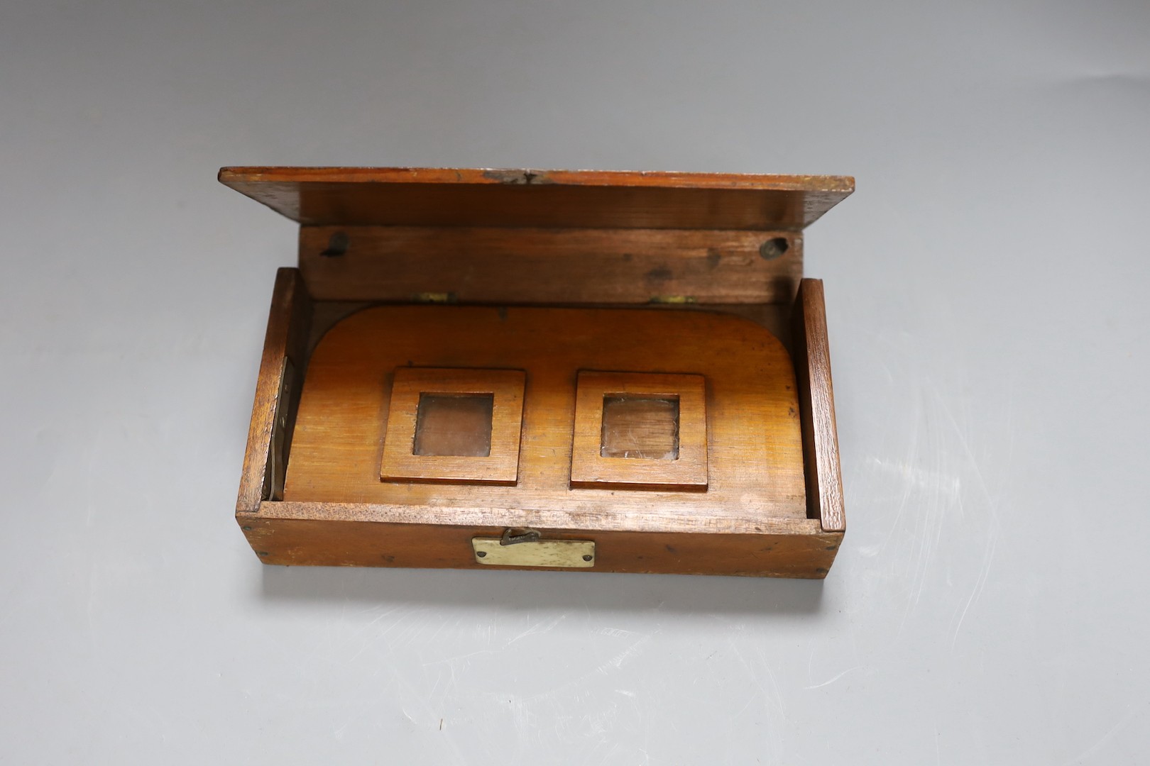 A stereoscopic viewer ‘The “Perfecscope”’ by H.C. White Co., another mahogany viewer and a quantity of mostly topographical cards including France, Italy and America